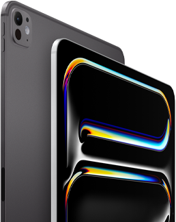 ตัวเครื่องภายนอกด้านหลังของ iPad Pro สีดำสเปซแบล็ค แสดงปุ่มปรับระดับเสียงและระบบกล้องระดับโปร, ตัวเครื่องภายนอกด้านหน้าของ iPad Pro สีเงิน แสดงมุมมนและขอบจอภาพสีดำ, จอภาพแสดงพื้นหลังสีดำที่มีลายเส้นนามธรรมหลากสีสัน